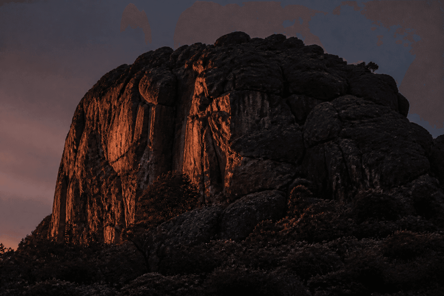 Hanging Rock at dusk, a long-lens view of the monolith.