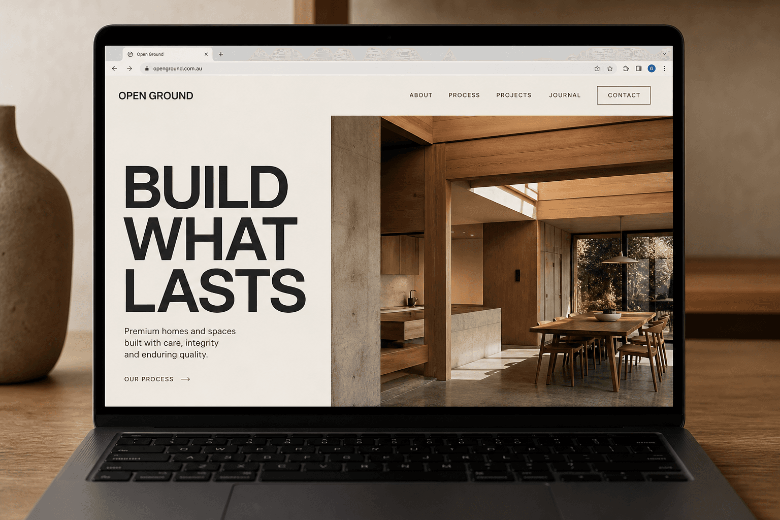 Open Ground sample website on a laptop.