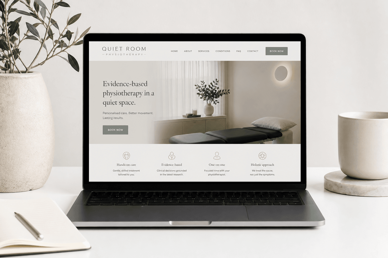 Quiet Room sample website on a laptop.