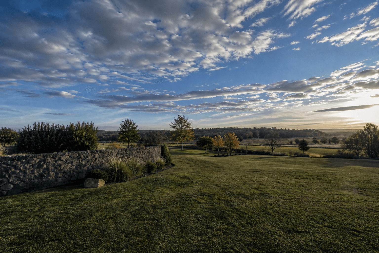 A rural venue landscape in late light.